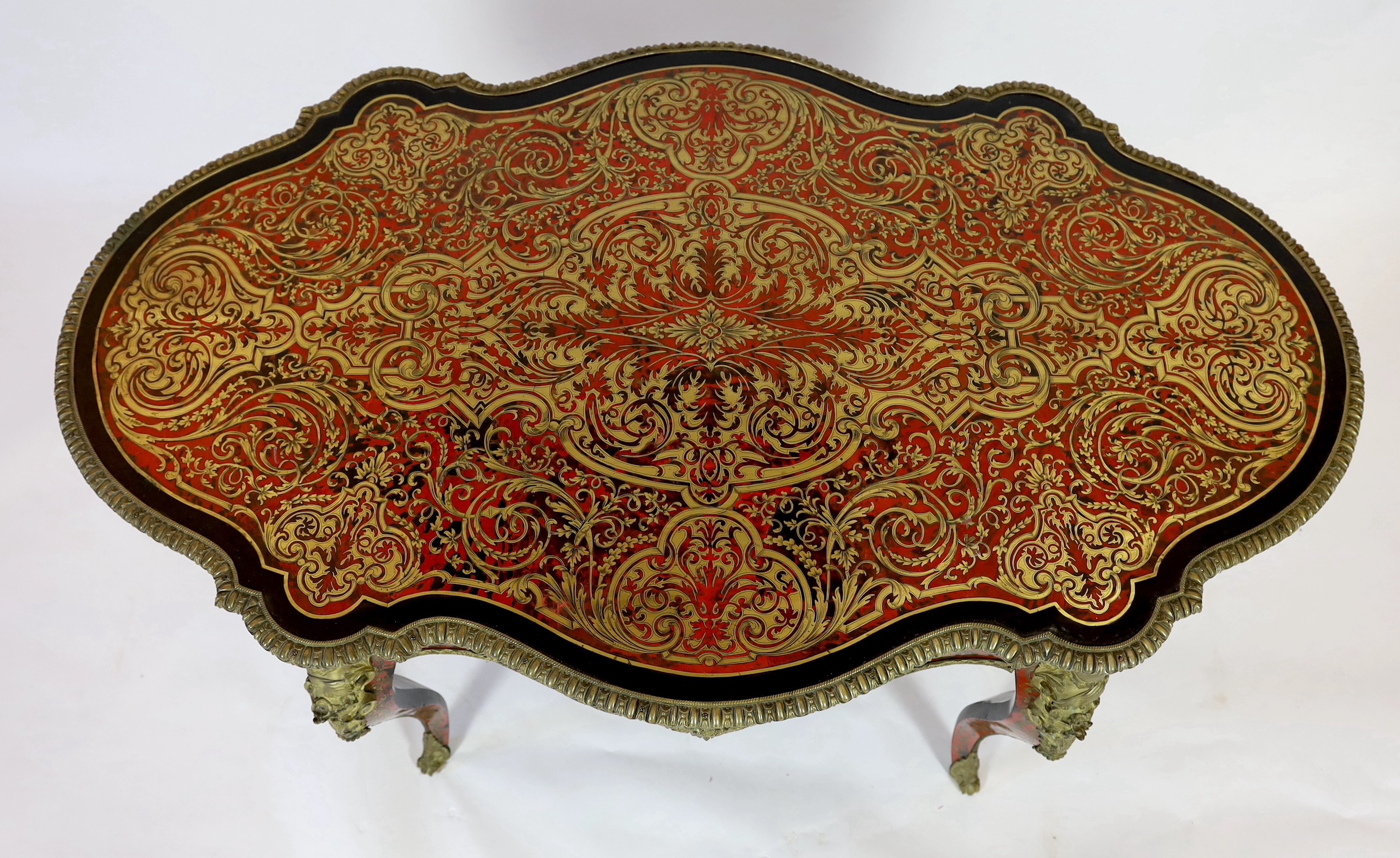 A 19th century French red boulle bureau plat, width 147cm depth 88cm height 77cm